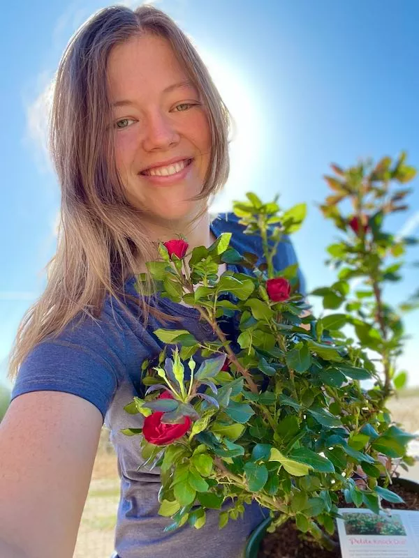 julia - holding a rose plant